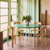 _0000_Rey-Chair-golden-wb-lacquer_Two-Colour-green-mint-tabletop-ivory-powder-coated-steel-legs_Arcs-Vase-mirror.jpg
