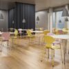 Fritz Hansen Myren™ stole i gul og rosa i kantine og mødemiljø