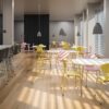 Fritz Hansen Myren™ stole i gul og rosa i stort kantinemiljø med Serie 7™ barstole