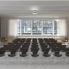 Fritz Hansen Syveren™ stole med skriveplade i konferencesal